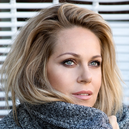 Headshot of Kristine Opolais